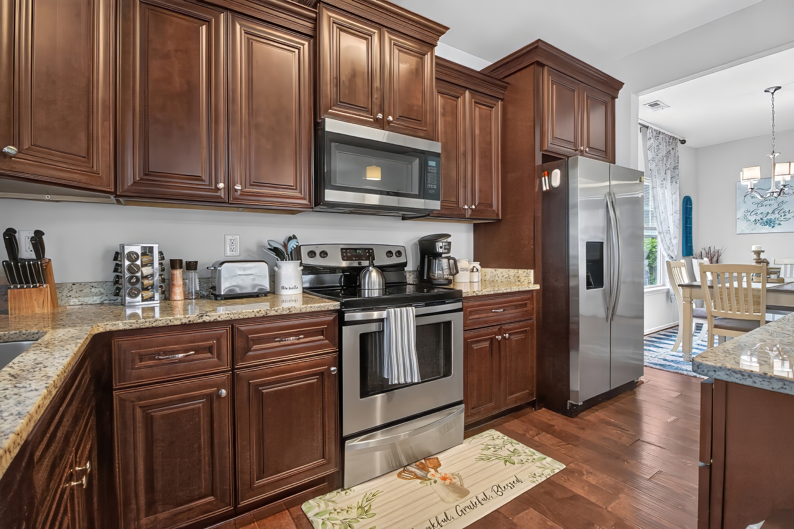 Spacious gourmet kitchen with granite counters and stainless appliances
