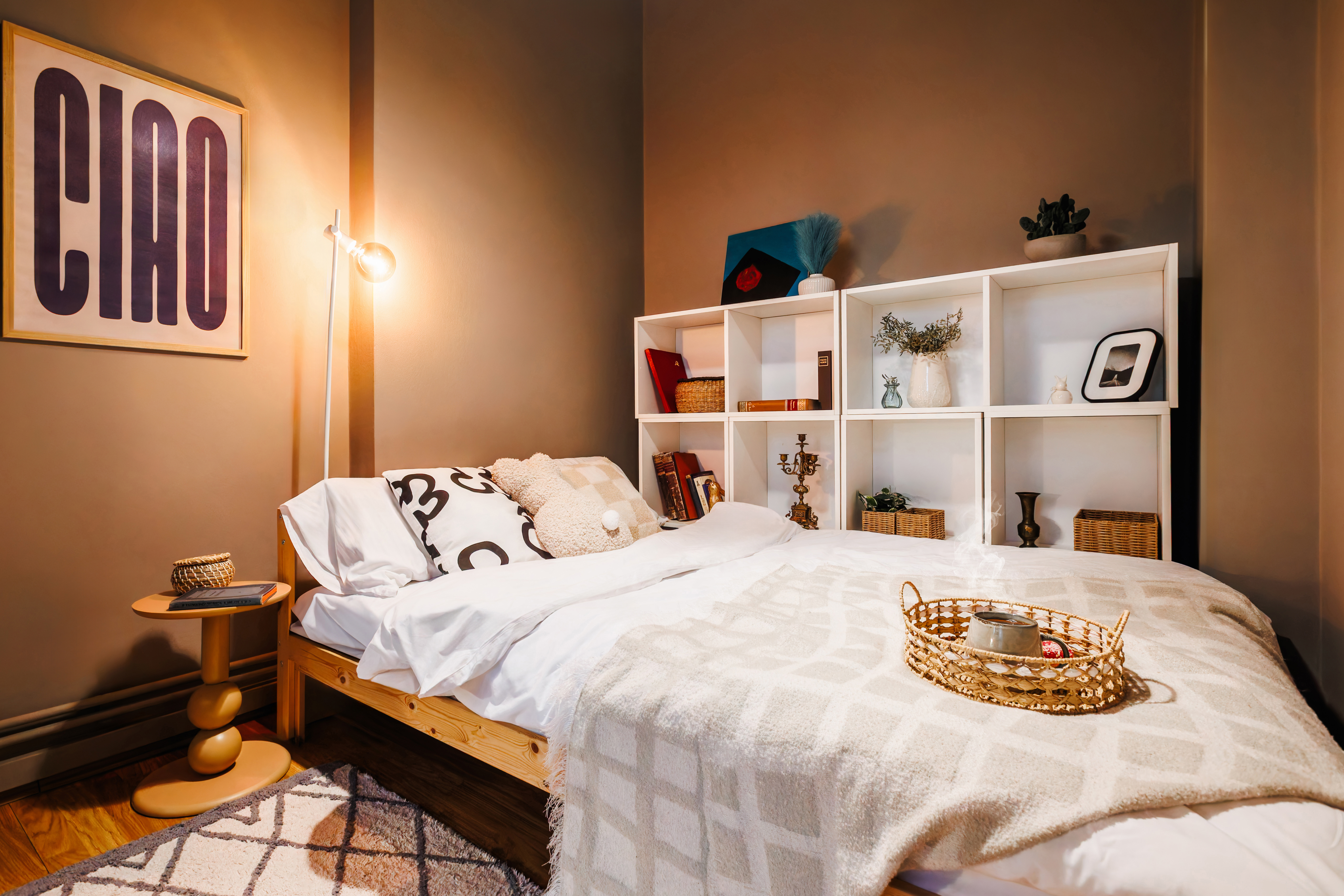Cozy boutique-style bedroom with warm lighting and stylish decor