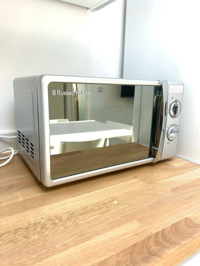 Modern living at its best on Uxbridge Road, Greater London, with easy access to Notting Hill, Acton, and Ealing. Featuring a stylish kitchen, cozy bedroom, chic decor, and a peaceful garden