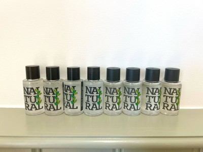 Simple and neat bathroom in Greater London, near Notting Hill, Acton & Ealing. Comes with a modern toilet, wall-mounted sink, heated towel rail, and stylish green lower wall panels with a large mirror.