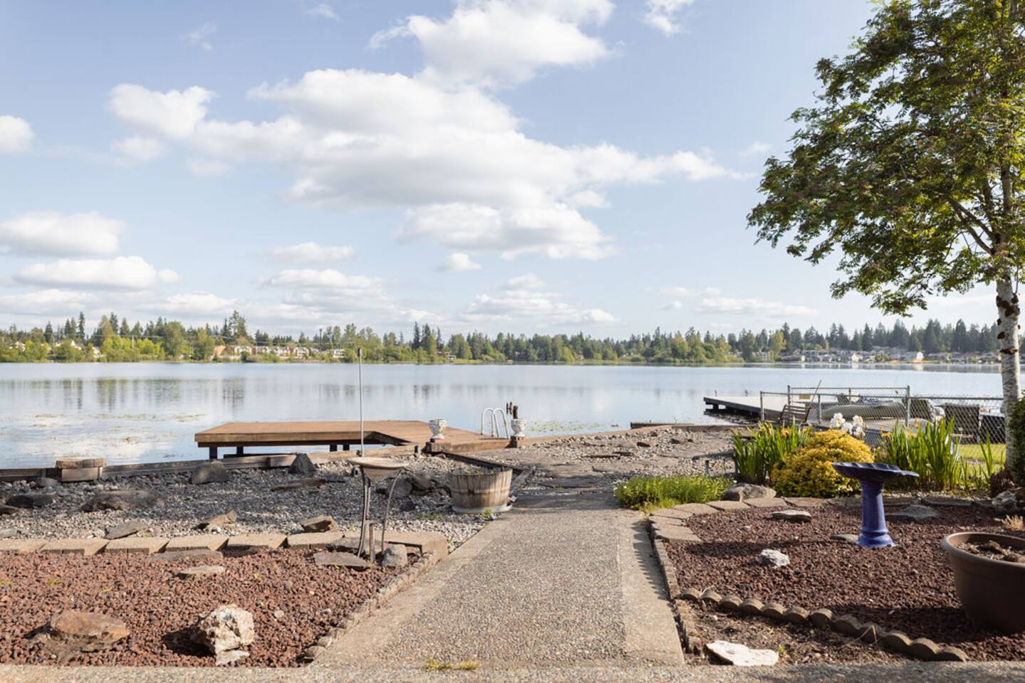 Private lakeside retreat with private dock access with stairs leading into the lake.