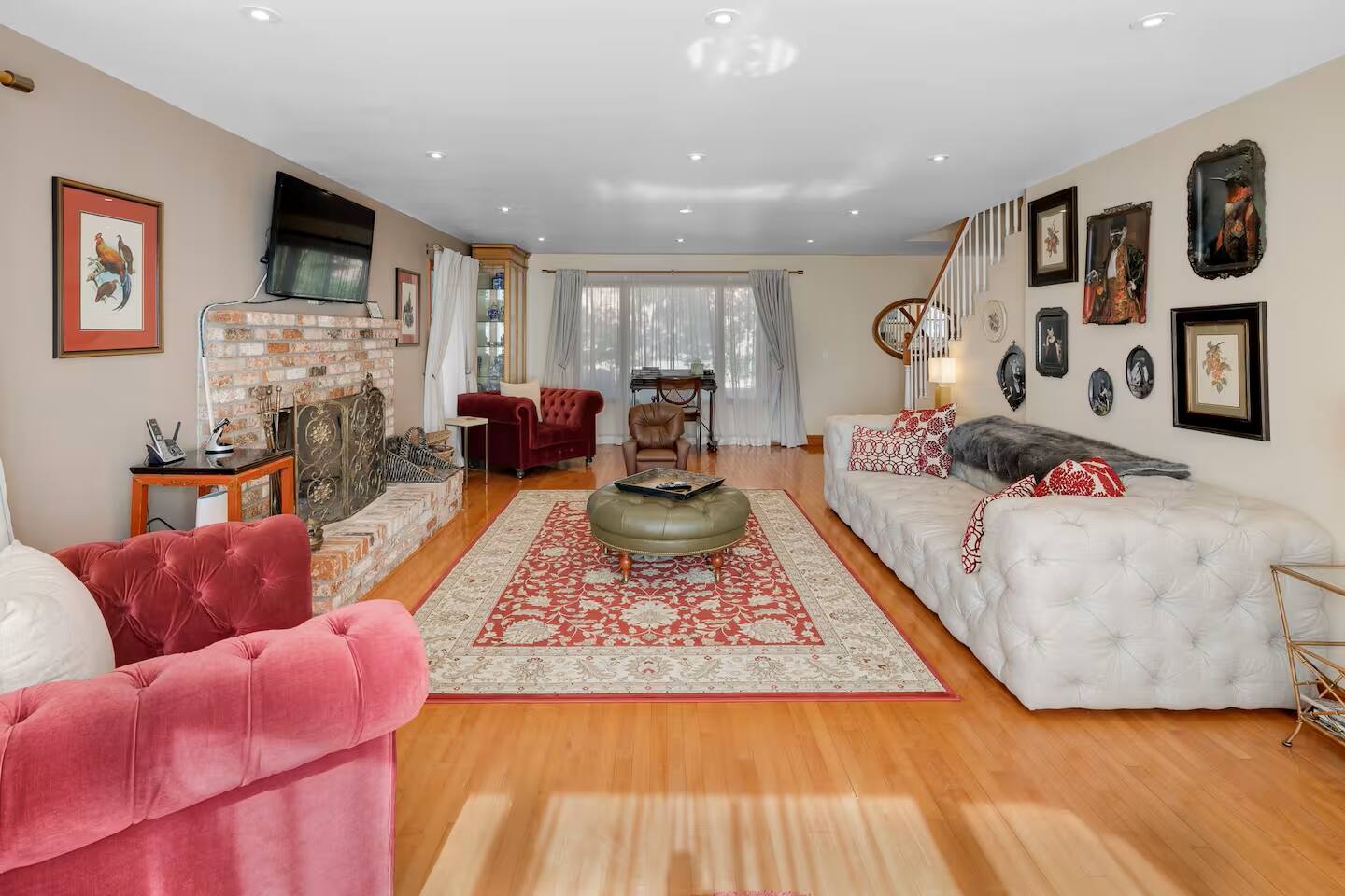 A luxurious yet inviting living space, perfect for meaningful conversations, movie night and cozy evenings by the fireplace.