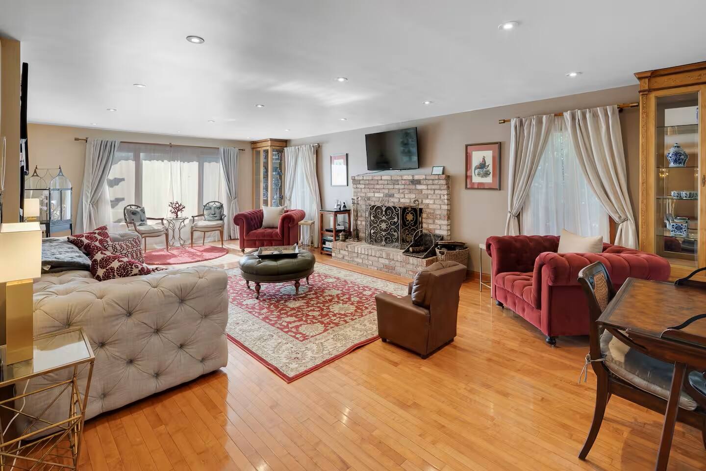 A luxurious yet inviting living space, perfect for meaningful conversations, movie night and cozy evenings by the fireplace.