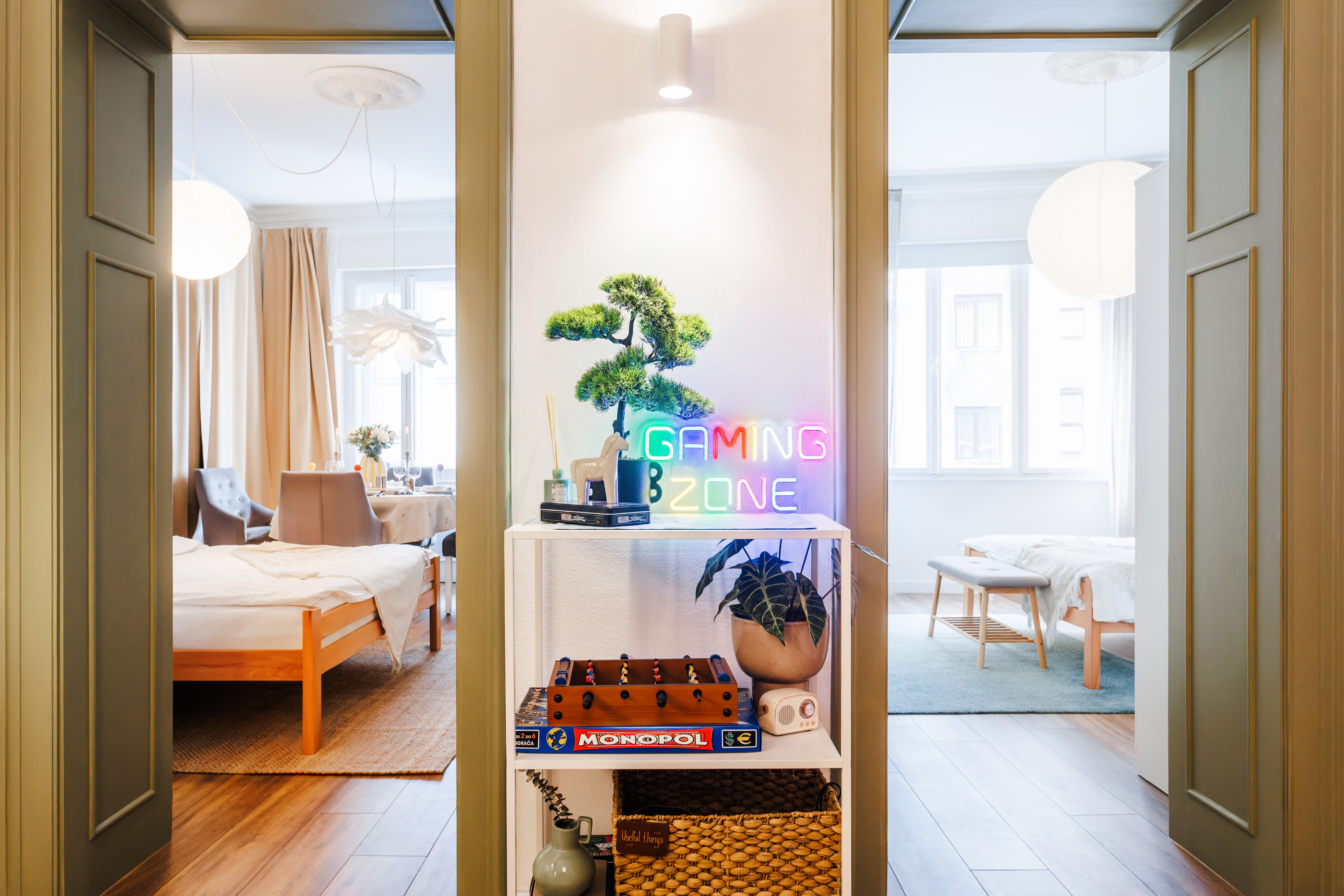 Bright, stylish interior with playful decor and sun-filled adjoining rooms