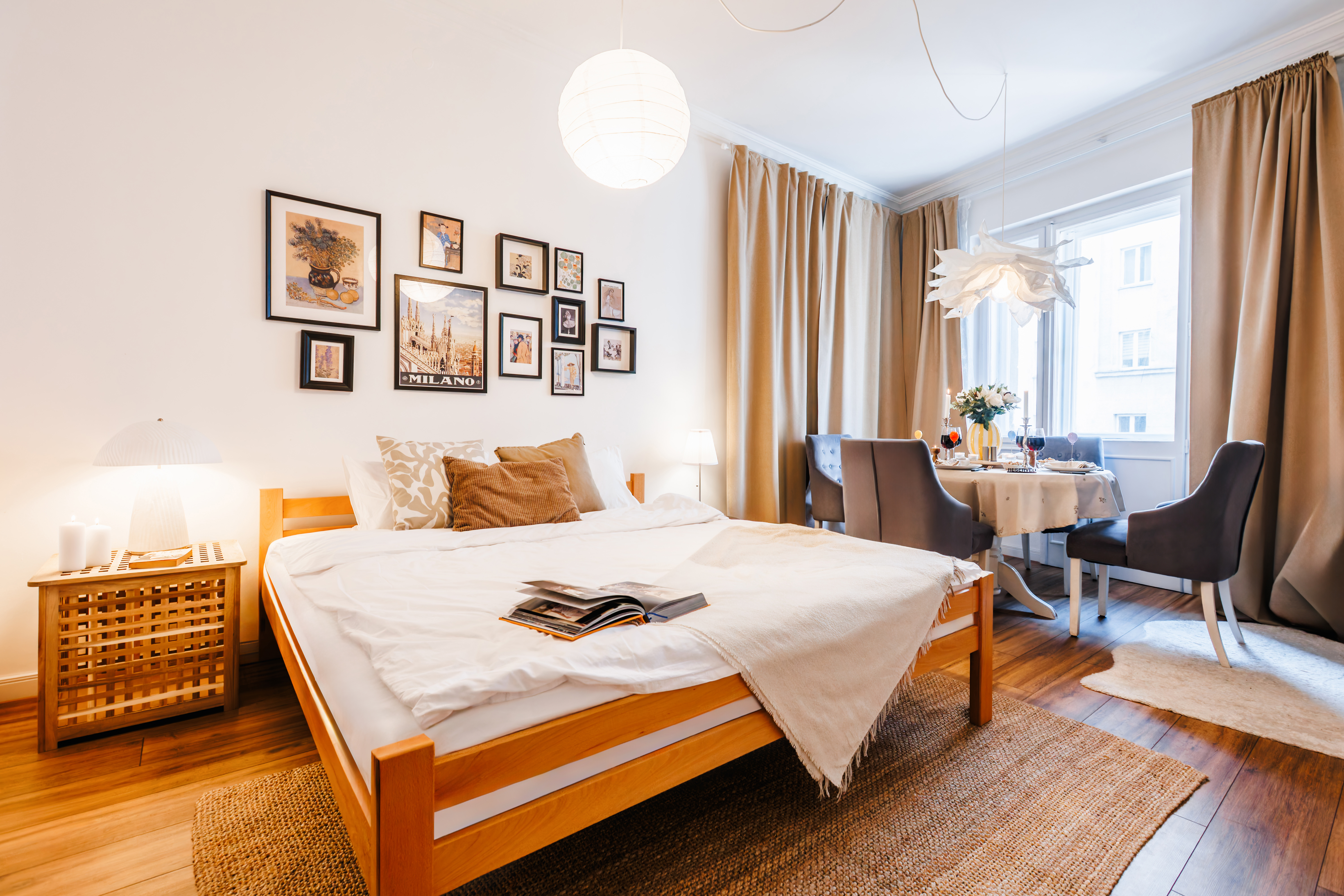 Bright, stylish bedroom with dining nook and abundant natural light