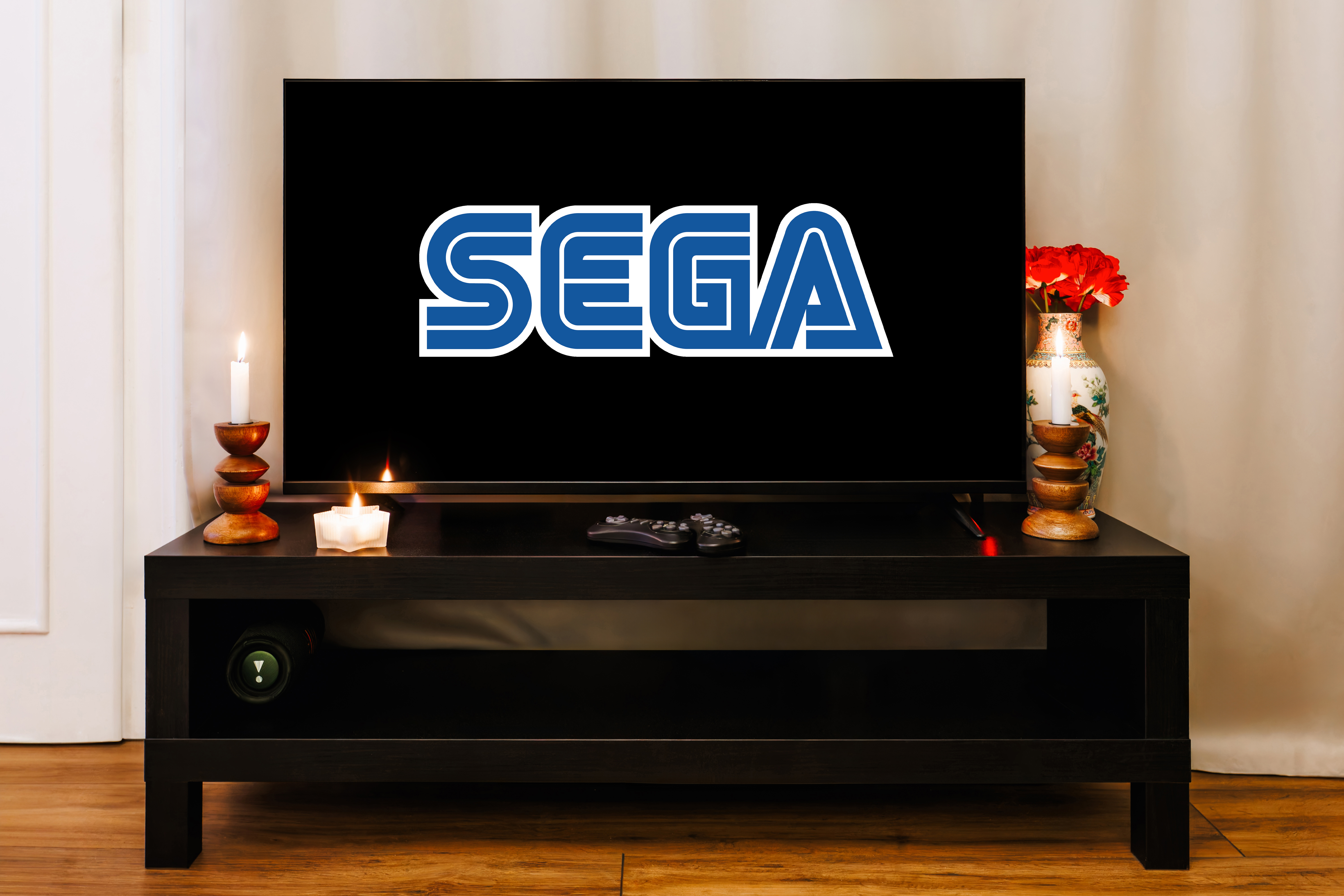 Cozy TV lounge with gaming setup, candles, and stylish decor