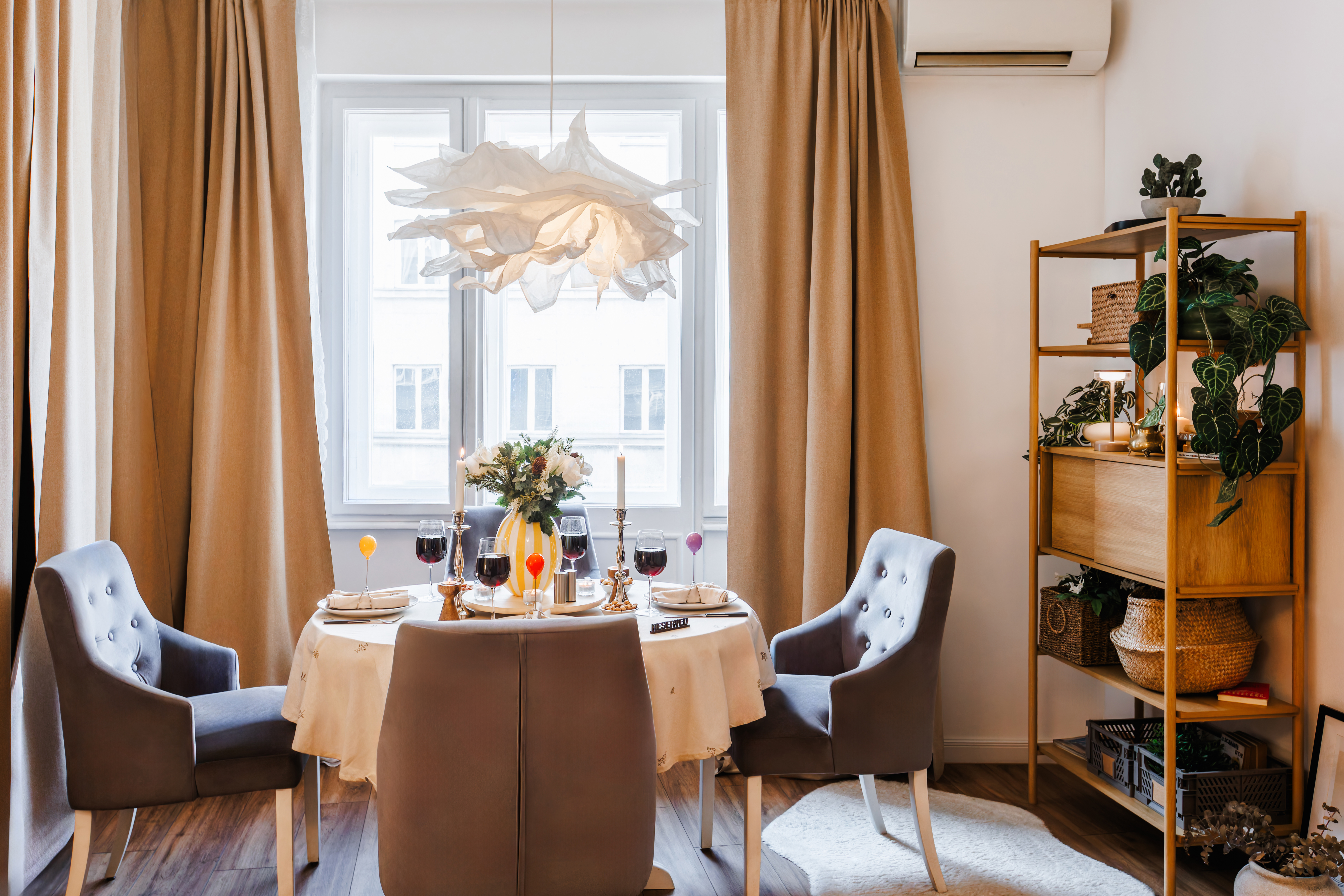Bright, elegant dining nook with stylish decor and cozy seating for four