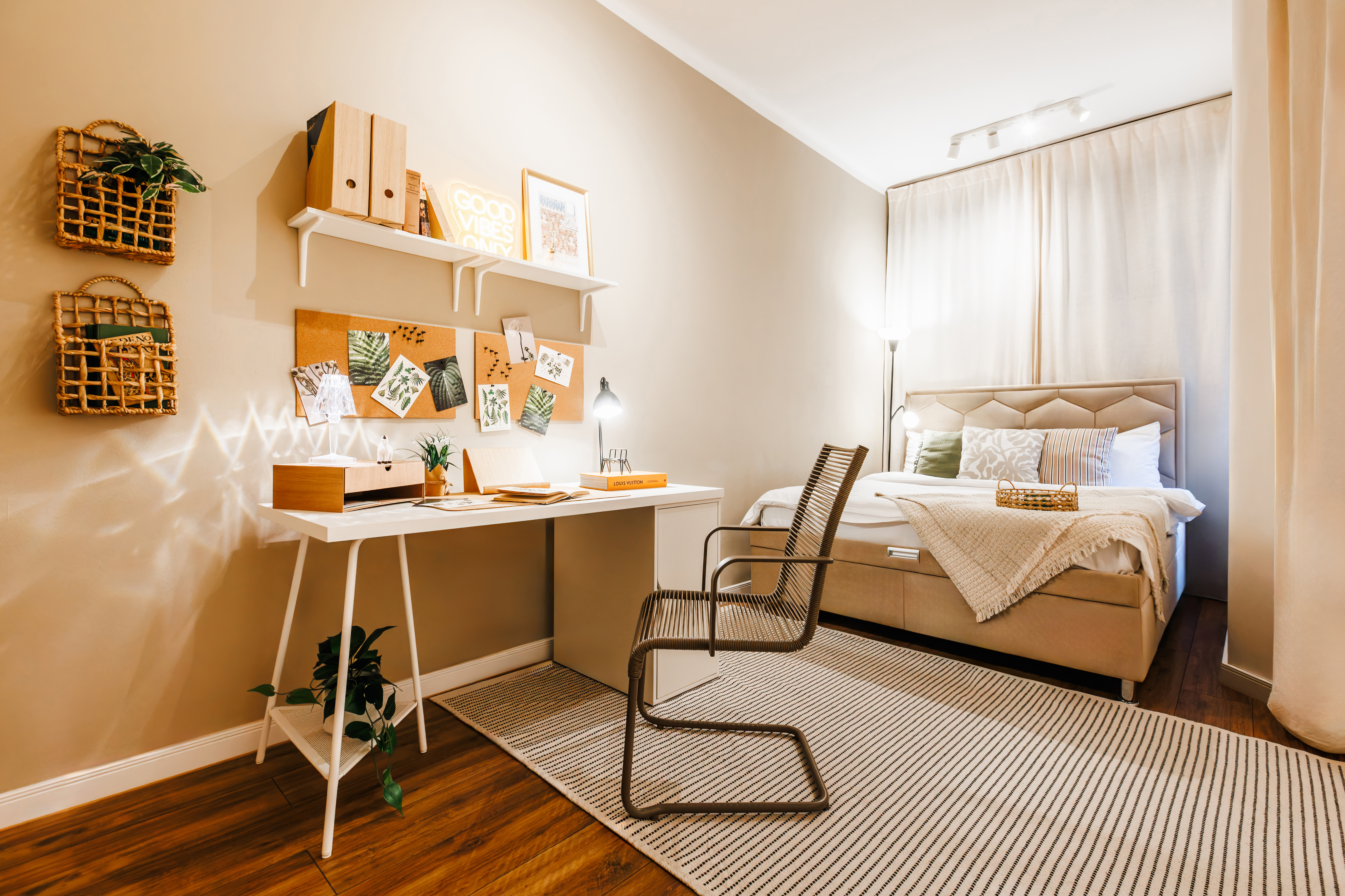 Cozy designer bedroom with workspace and warm boutique-style touches