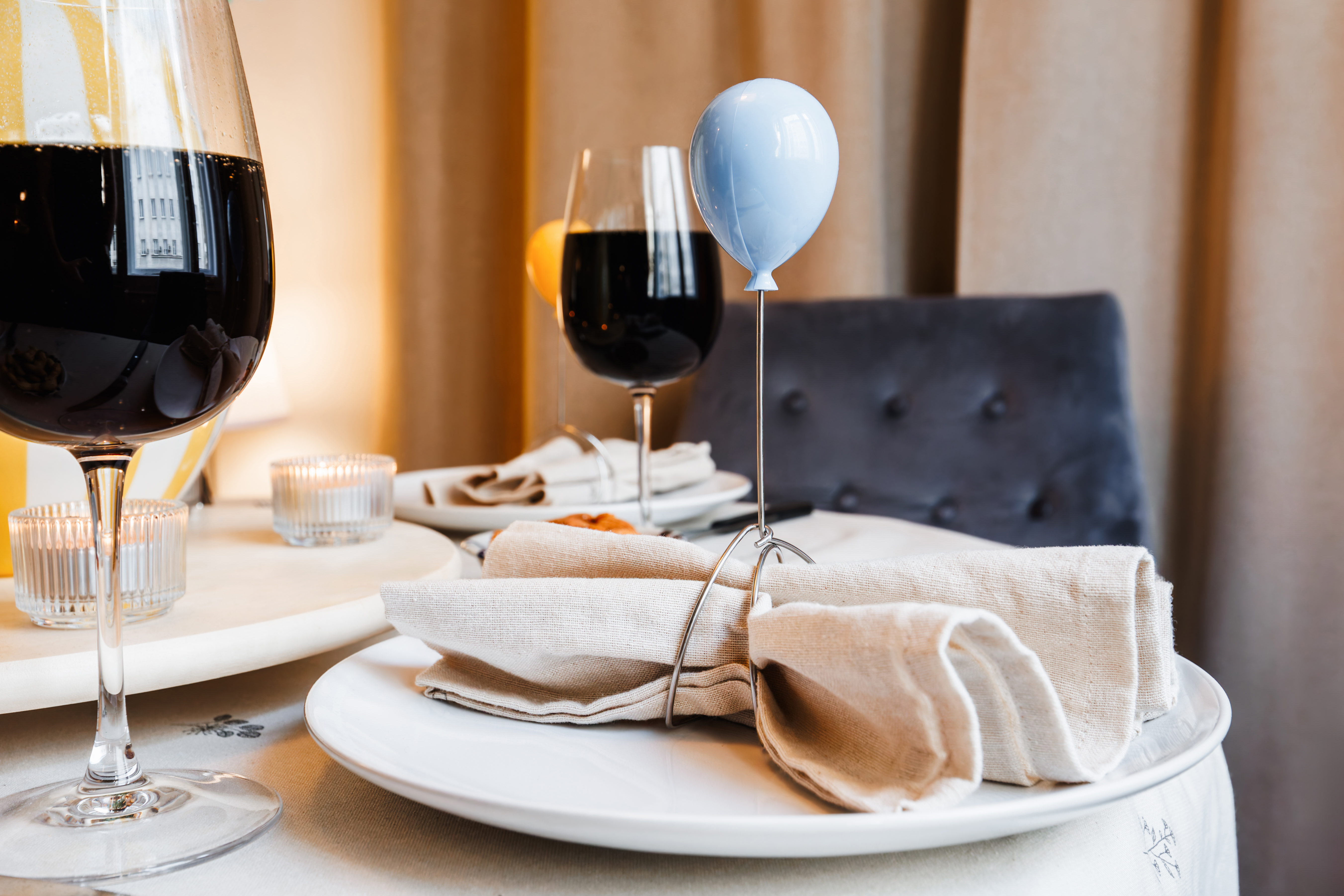 Elegant candlelit dining setup with wine and cozy ambiance