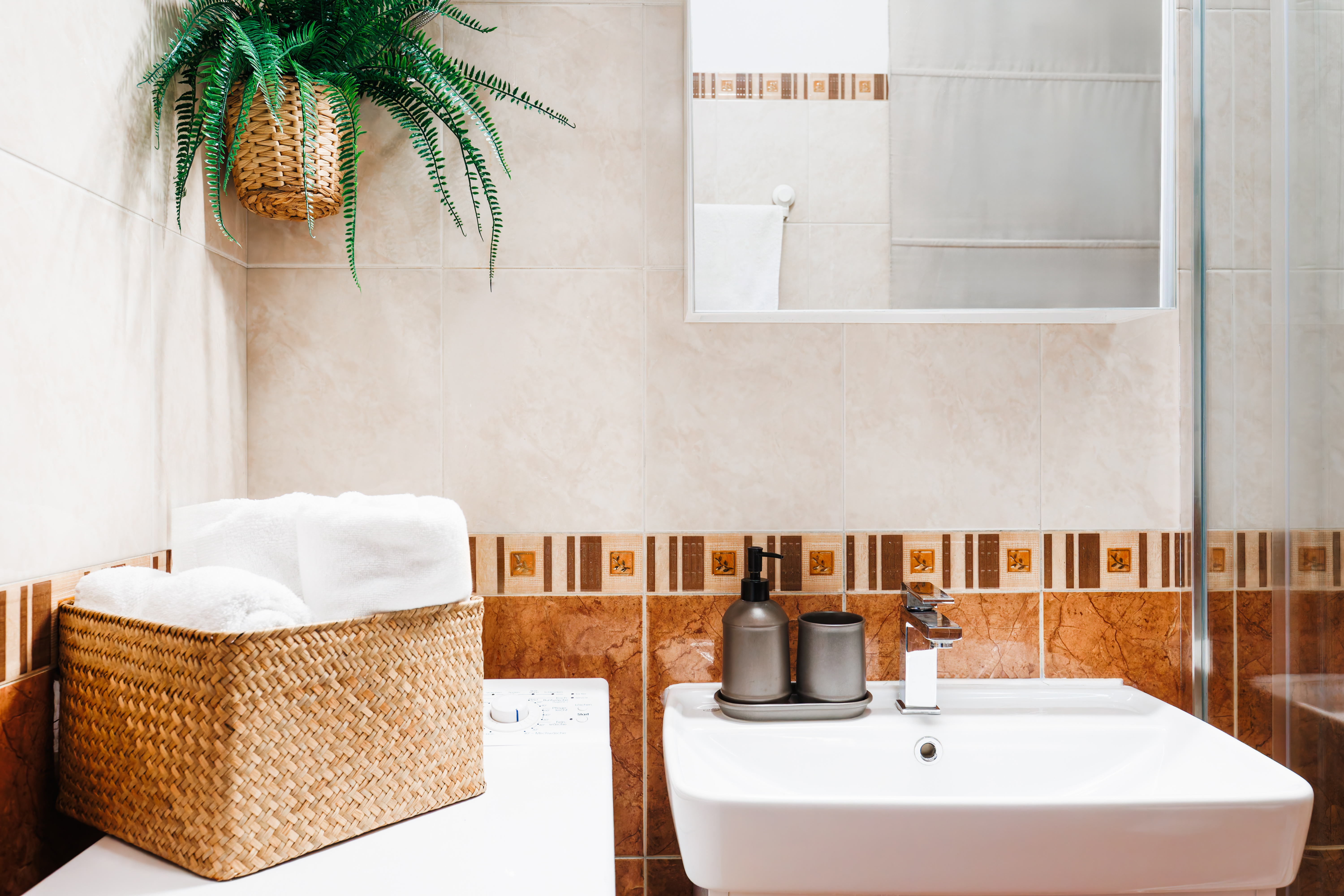 Bright, stylish bathroom with fresh towels and thoughtful decor
