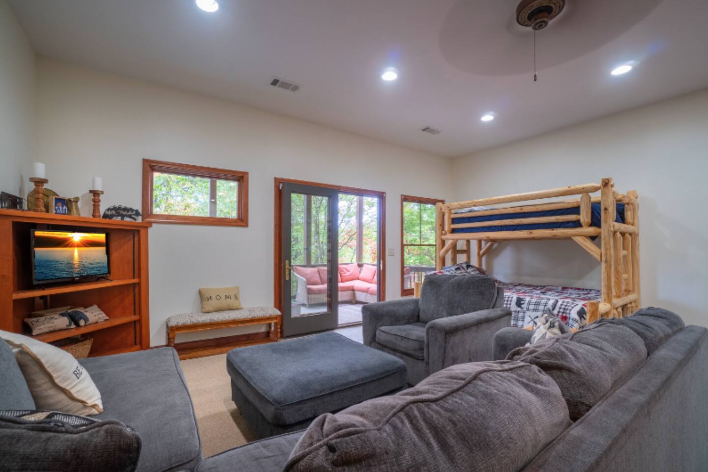 Basement couch with TV and bunk beds