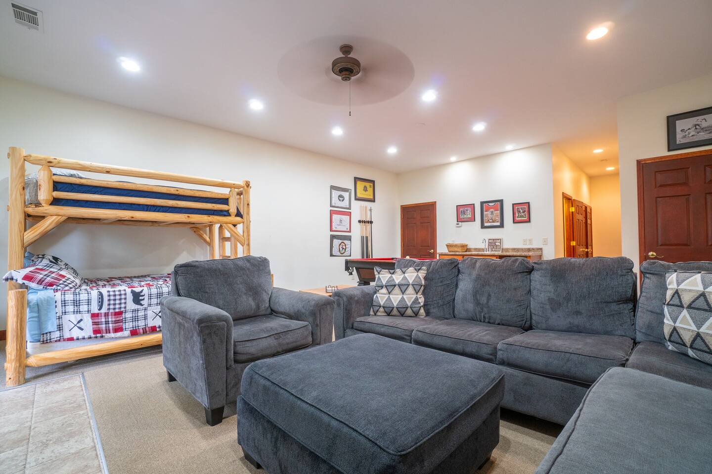 Basement with a couch and bunk bed