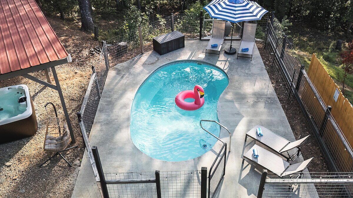 Private pool with beach chairs and towels