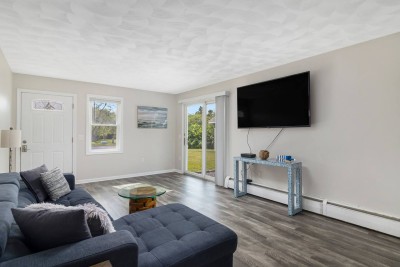 Downstairs living area with walk out to driveway and slider to backyard.