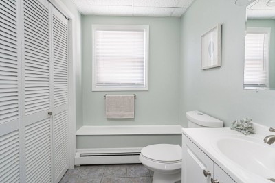 Bathroom #2 Located on  the Lower Level (Shower, Vanity and Toilet)