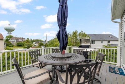 Elevated Deck off Kitchen with Outdoor Seating and Propane Grill