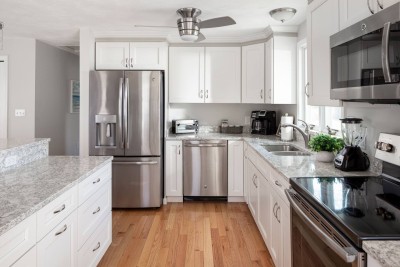 New Designer Kitchen with Granite Countertop and Stainless Steel Appliances.