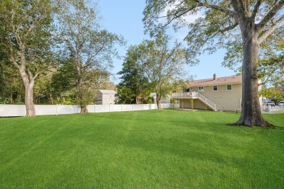 Beautiful fenced in backyard, with elevated deck to cook out on.