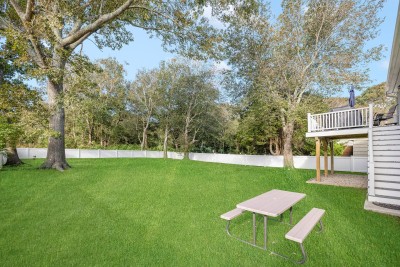 Beautiful fenced in backyard, with elevated deck to cook out on.