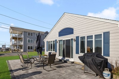 Front View of House with Patio Furniture and Grill