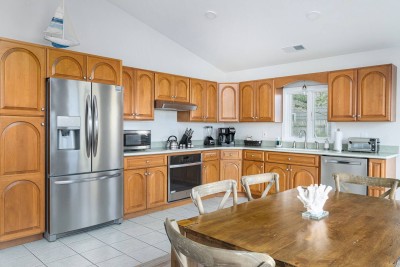 Kitchen with Stove, Dishwasher, Coffee Maker, Blender, Toaster, Oven and Refrigerator.