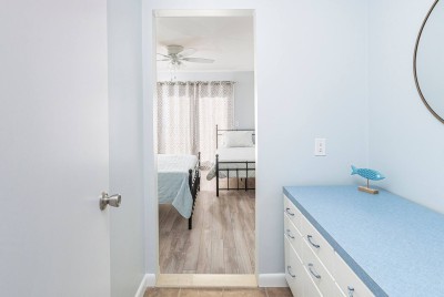Looking in from vestibule into Bedroom #6, Queen Bed with additional Twin Bed