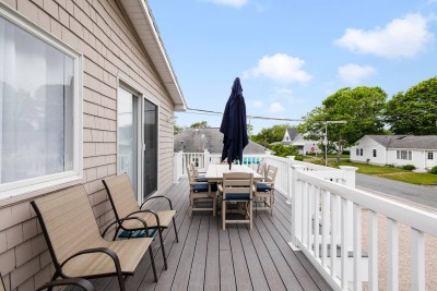 Elevated Deck with propane Grill, off the Kitchen on second floor to enjoy a great evening after a day at the beach!
