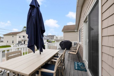 Elevated Deck with propane Grill, off the Kitchen on second floor to enjoy a great evening after a day at the beach!