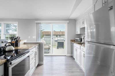 Kitchen area, leading to spacious new deck with Grill