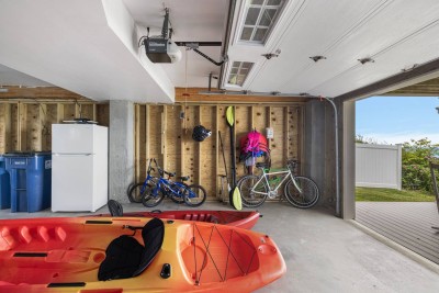 2 Kayaks and an assortment of bikes and beach gear is provided.