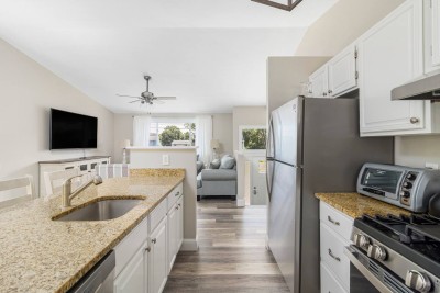 Kitchen with all modern appliances. Refrigerator, Dishwasher, Toaster, Coffee Maker, Microwave and more.
