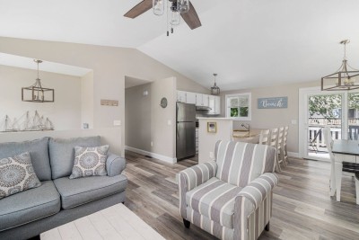 Open upstairs with Living room, dining area and Kitchen.