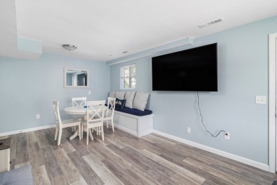Downstairs living area with Big Screen TV and Card Table.