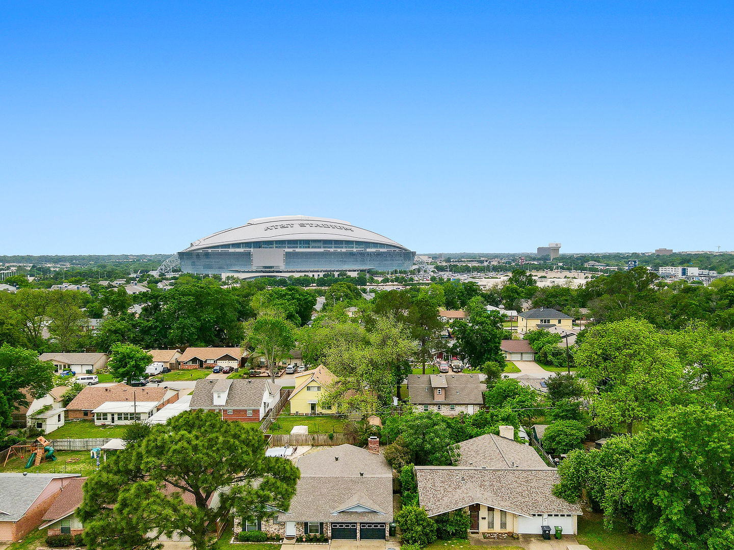 Sweeping neighborhood views with a stadium skyline in the distance