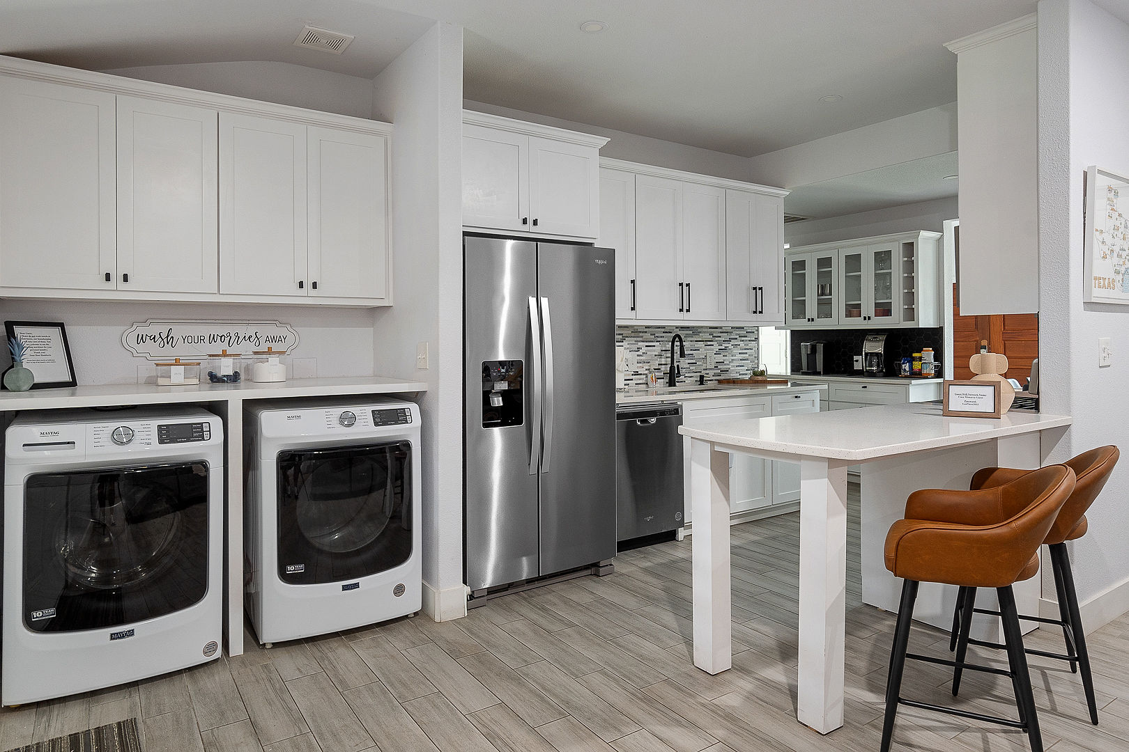 Bright modern kitchen with breakfast bar and in-home washer/dryer