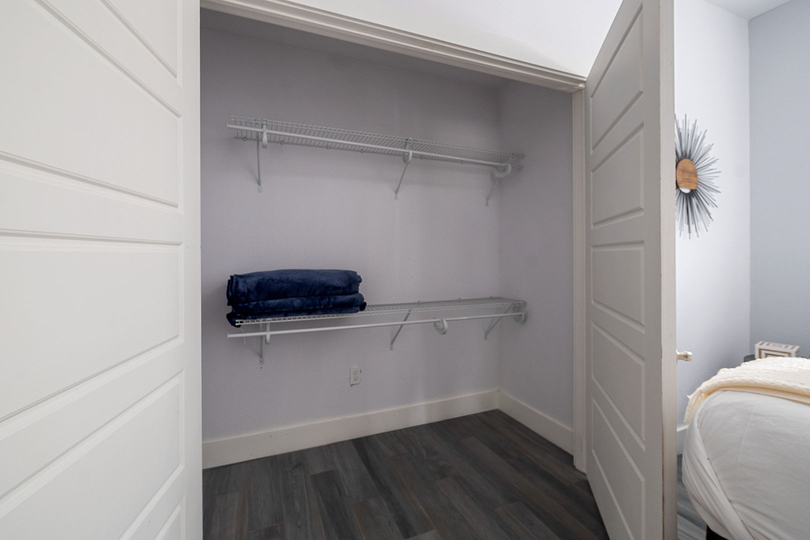 Spacious walk-in closet with ample shelving and easy bedroom access
