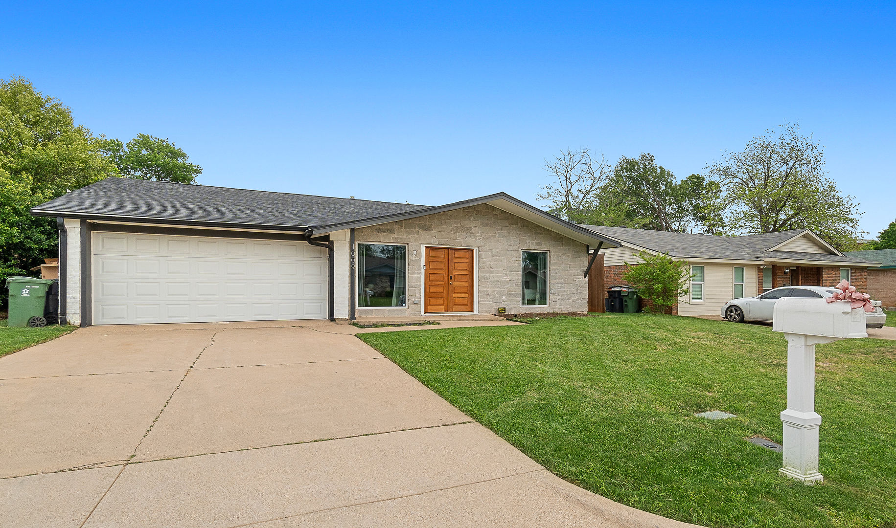 Charming single-story home with garage, spacious driveway, and great curb appeal