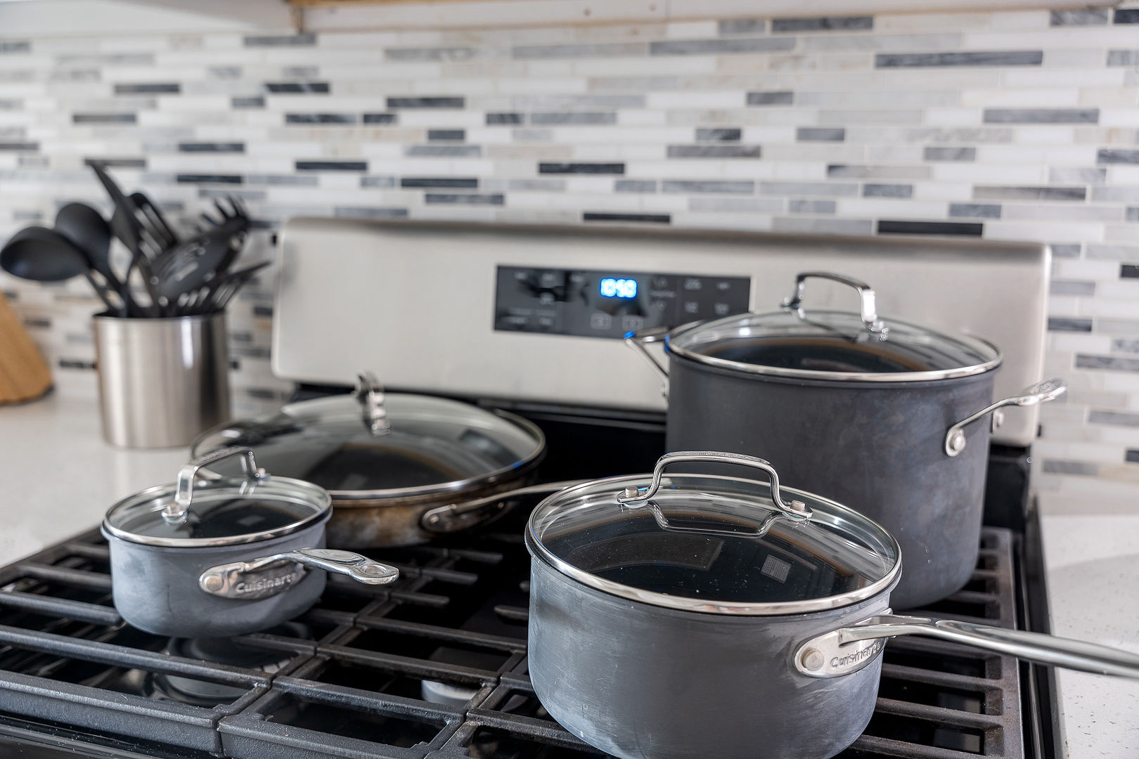 Fully equipped modern kitchen with gas range and cookware ready to use