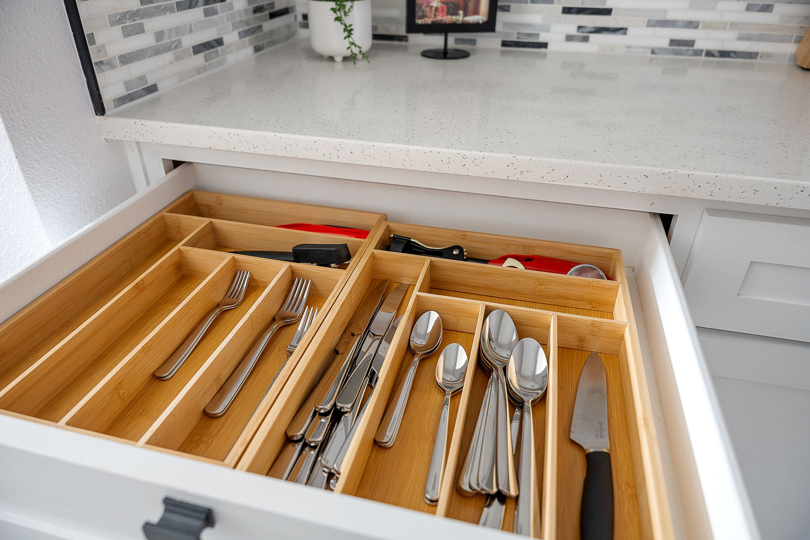 Well-stocked kitchen drawer with stylish finishes and organized essentials