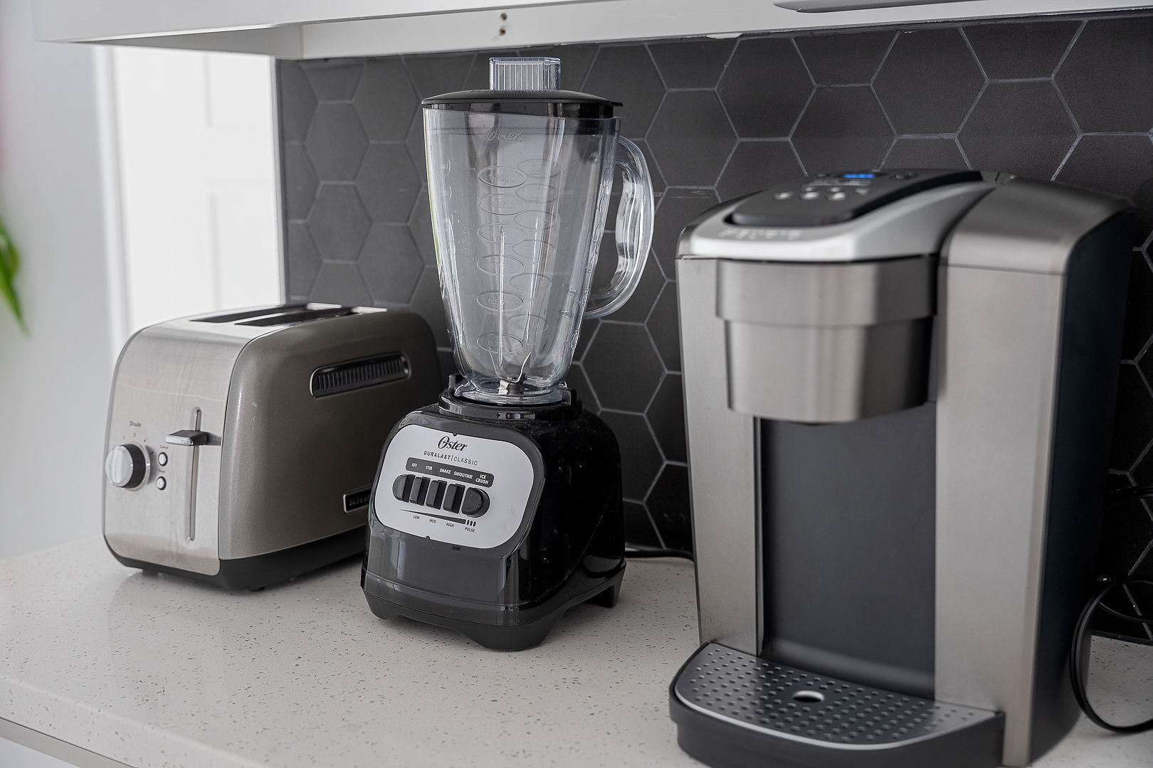 Well-stocked kitchen with coffee maker, blender, and toaster