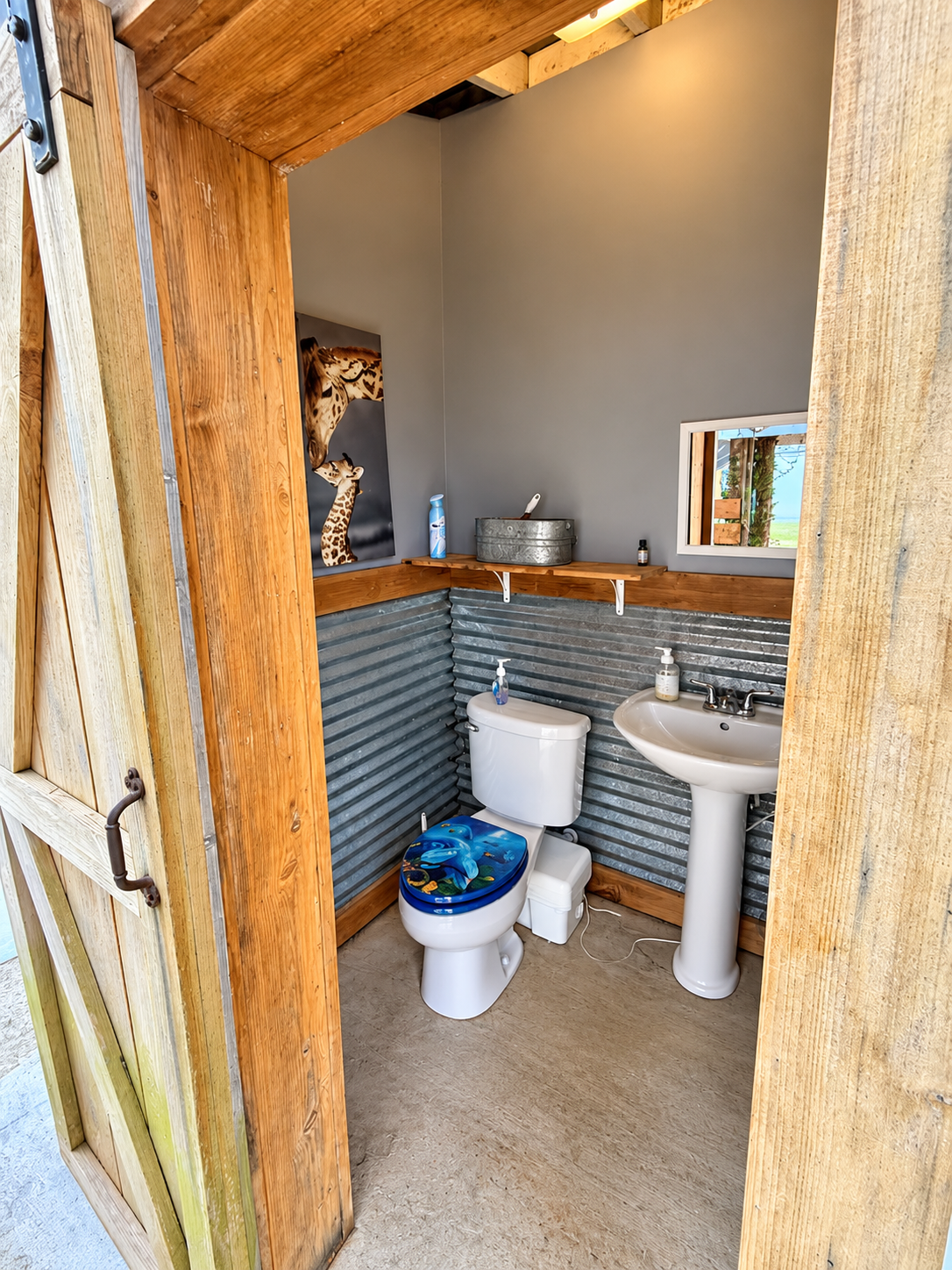 Rustic cabin-style half bath with modern fixtures and unique charm