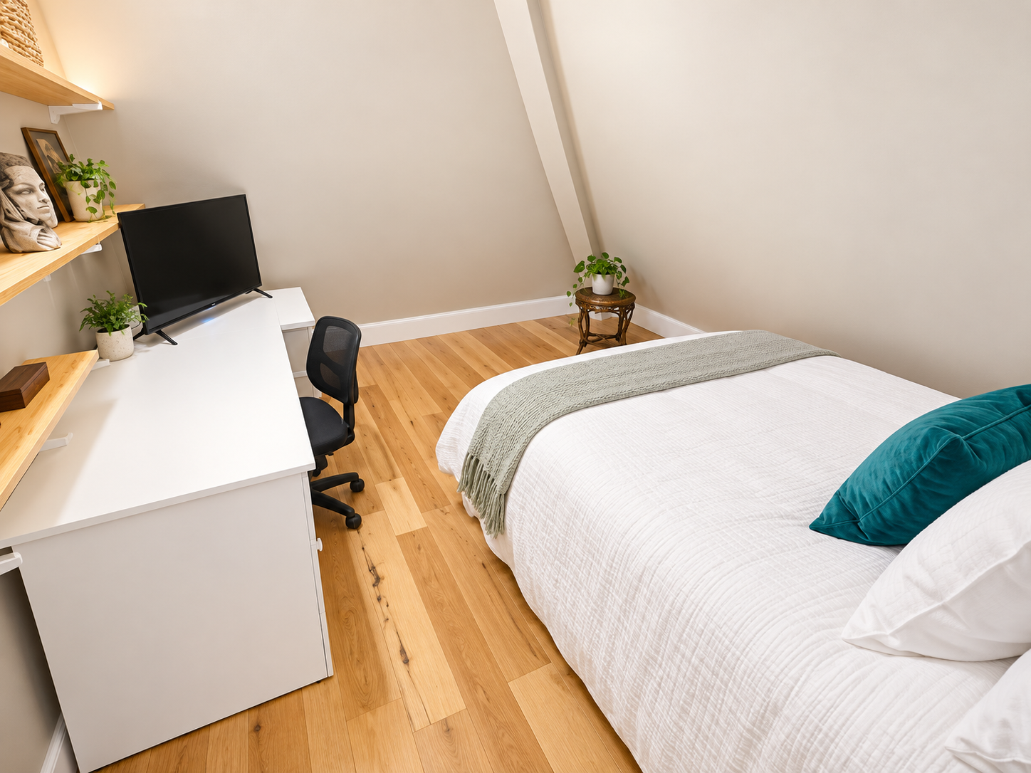Cozy bedroom with workspace, TV, and warm minimalist style