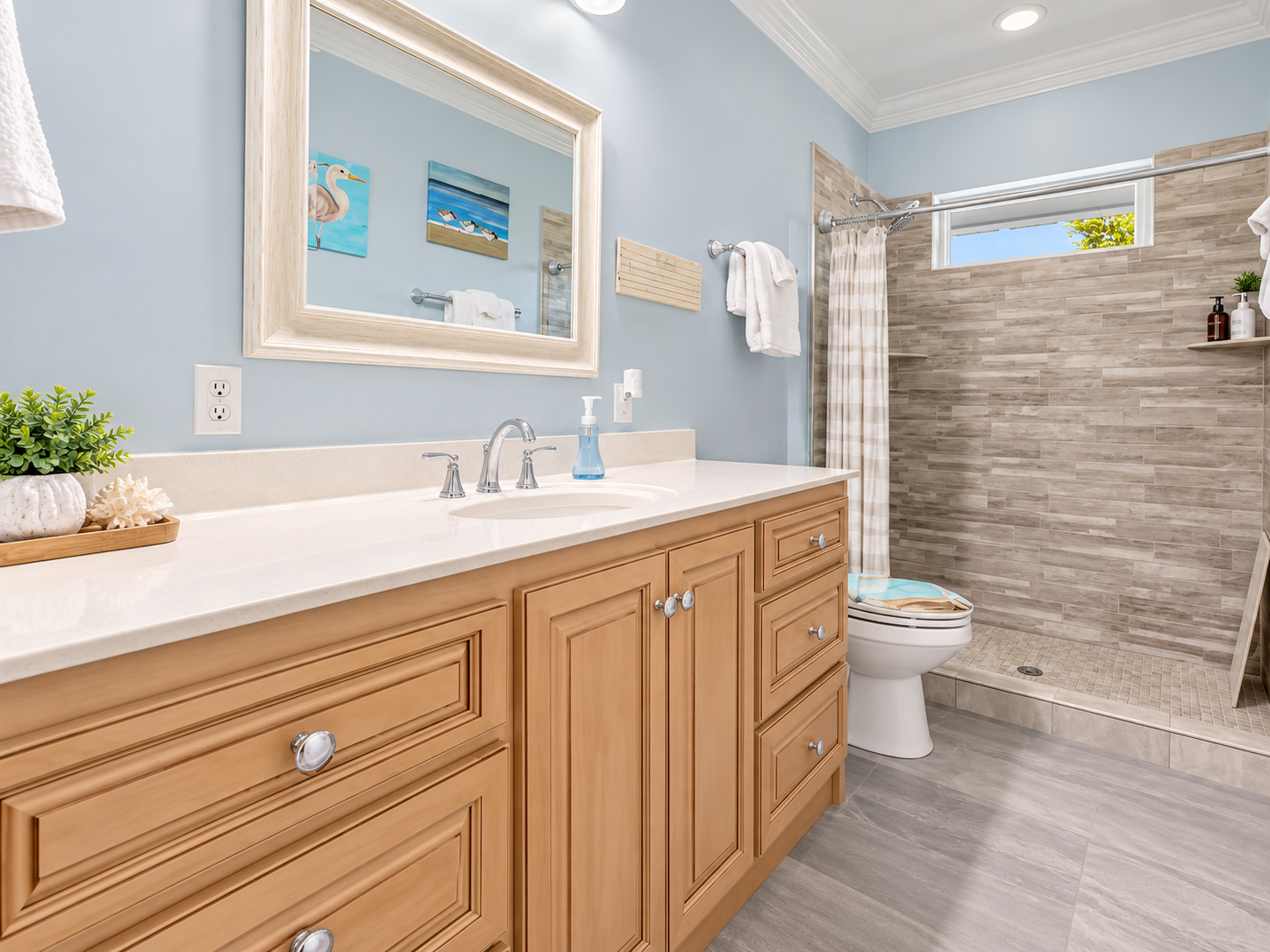 Bright spa-like bathroom with walk-in tiled shower and roomy vanity