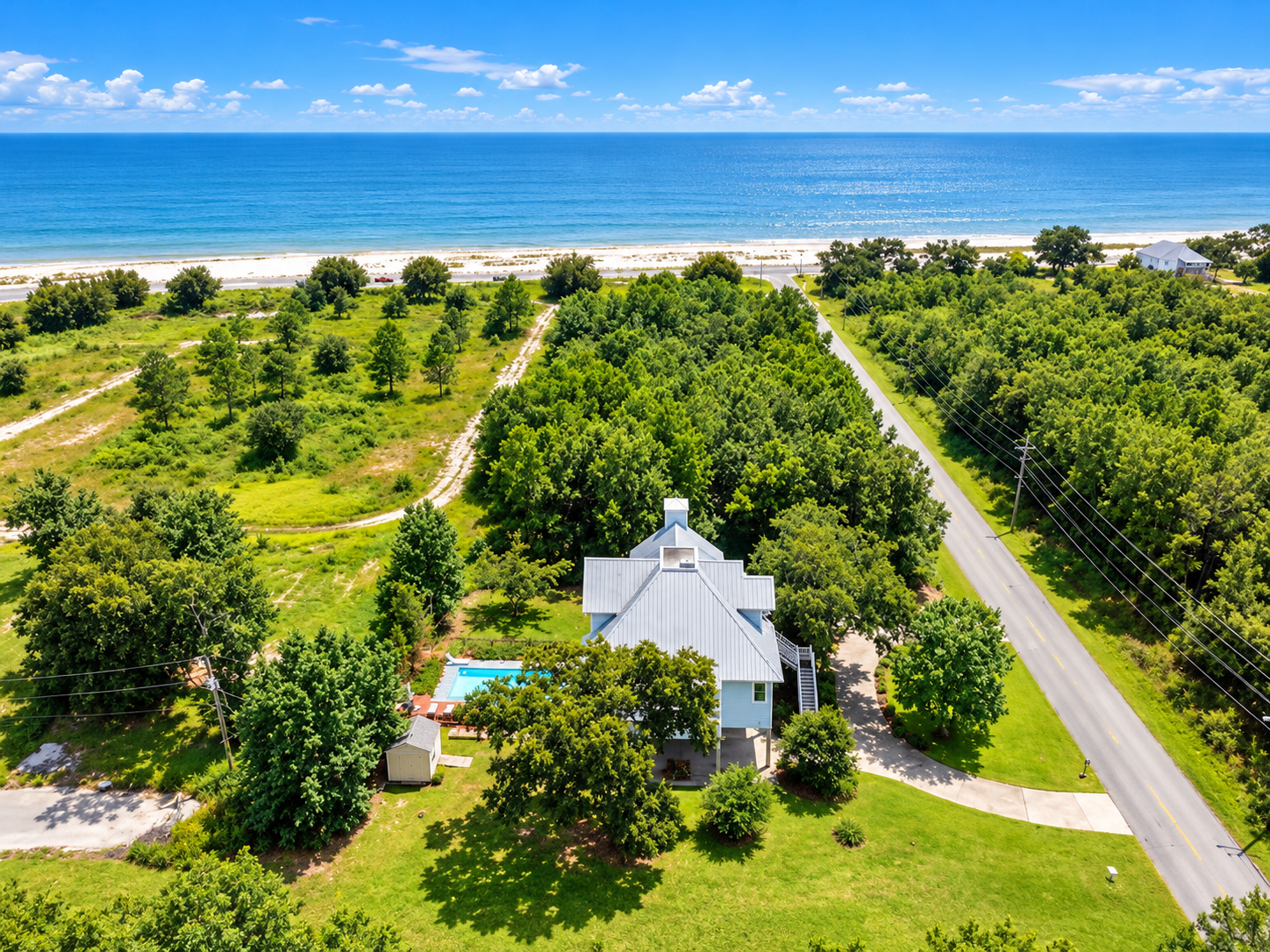 Private coastal retreat with pool, lush grounds, and easy beach access