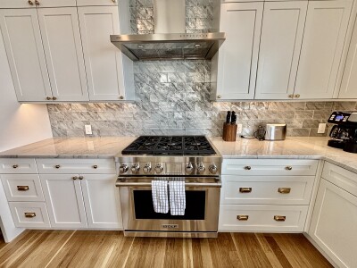 Chef-style kitchen with Wolf range and elegant modern finishes