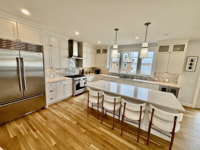 Bright gourmet kitchen with large island seating and premium finishes