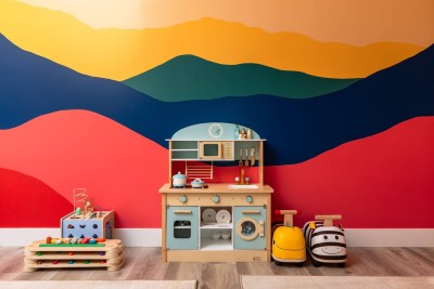 Dedicated Kids Playroom!  Let the little ones explore in their own vibrant space. Features a colorful mountain mural, a complete wooden play kitchen, and a selection of educational toys and puzzles. Child-friendly and safe—this room is pure fun!