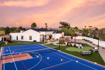 Backyard Oasis!  This huge, fenced yard has it all: a vibrant blue multi-sport court and a sparkling pool with an oversized deck. Fire pit for starlit nights, plus a kids' playground and trampoline. Unforgettable outdoor living!