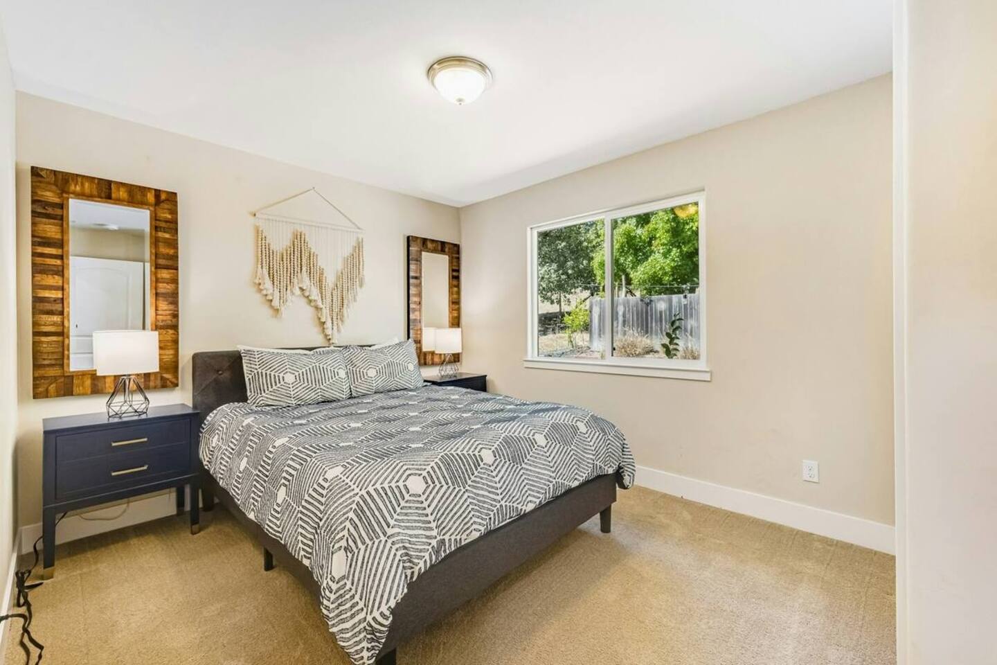 Cozy up in this inviting queen bedroom—calm, comfy, and restful.