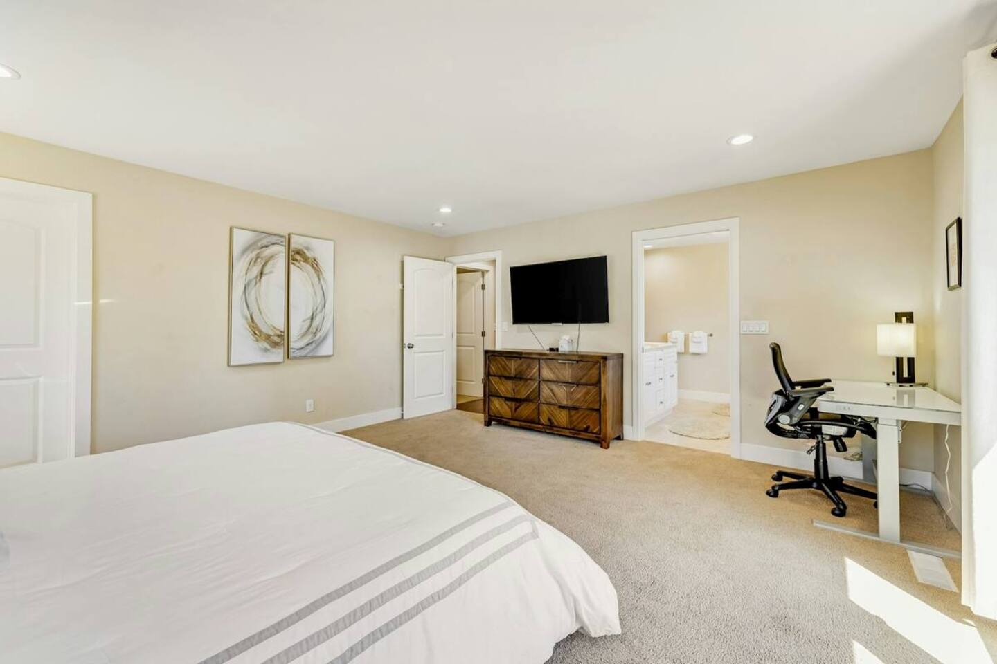 The ideal retreat—king bed, TV for cozy nights, workstation, and patio for fresh air.